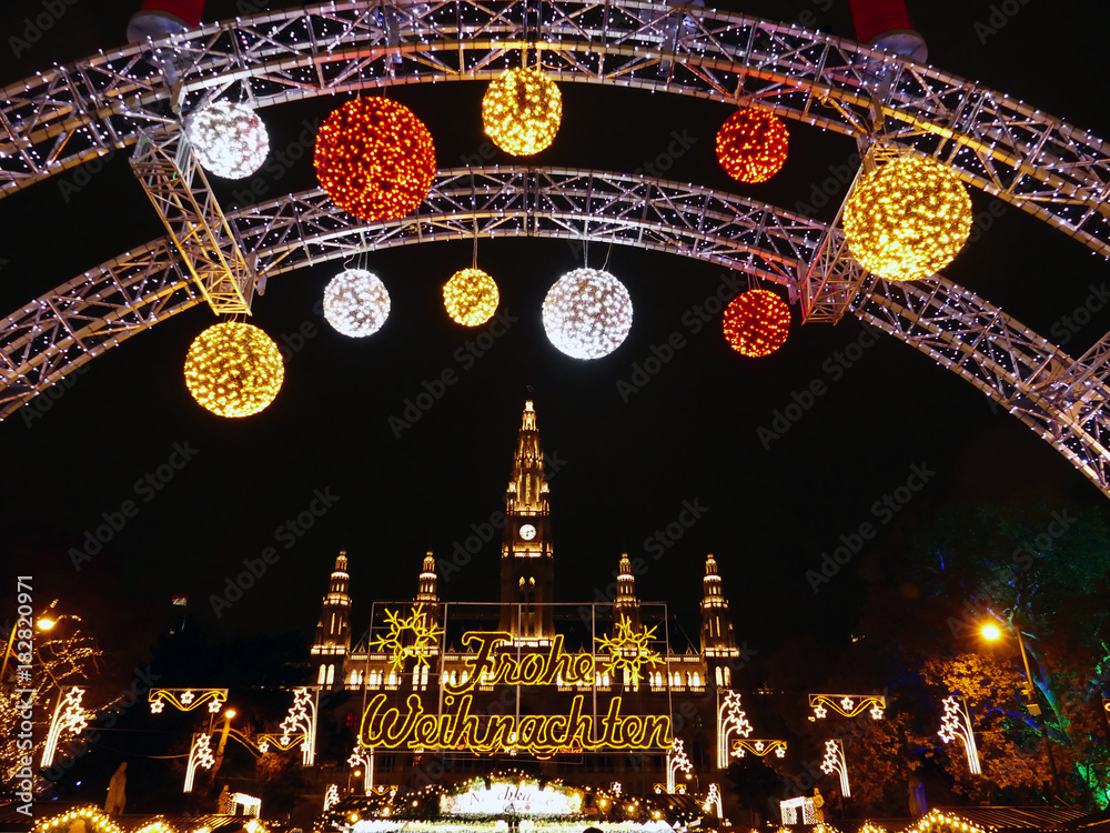 Φωτογραφία Traditional Christmas market  welcomes guests by City Hall in Vienna, Austria Merry Christmas as the the sign says n German
