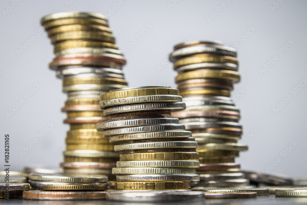 Stacks of Russian coins on a gray background with droplets of water. Stacks of Russian coins on a gray background with droplets of water.