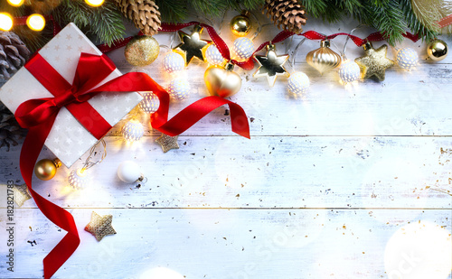 Christmas holidays composition on wooden background; Christmas tree decoration and copy space for your text