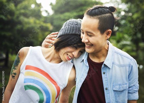 Smiling young couple standing outdoors