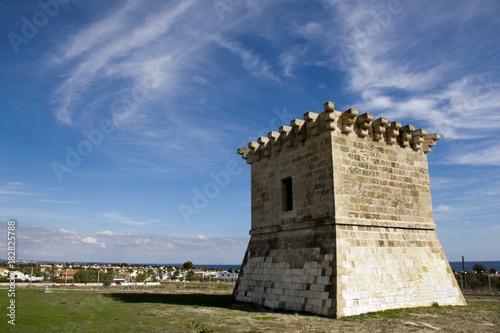 Outdoor architecture of an ancient Venetian tower in Cyprus and cloudy blue sky 
