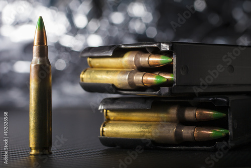 Canvas Print Five five six ammo with green tipped bullets stuffed into high capacity magazine