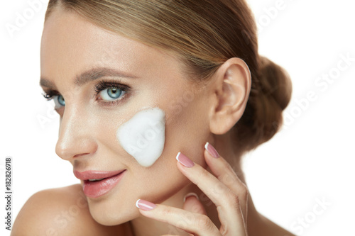 Beauty Skin Cosmetics. Beautiful Young Female With Foam On Face photo