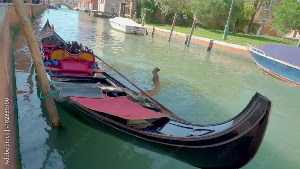 15014_A_black_gondola_being_tied_on_the_pole_in_Venice_Italy.mov 15014_A_black_gondola_being_tied_on_the_pole_in_Venice_Italy.mov