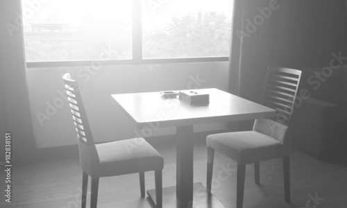 blur wooden table and chairs