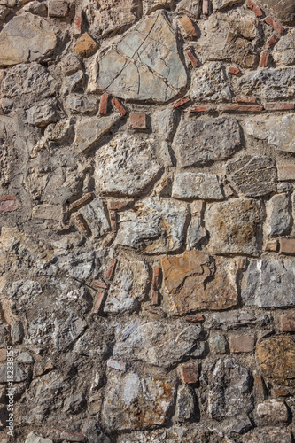 Fragment of old stony wall  natural texture