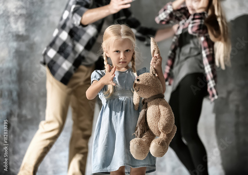 Little girl with toy rabbit...