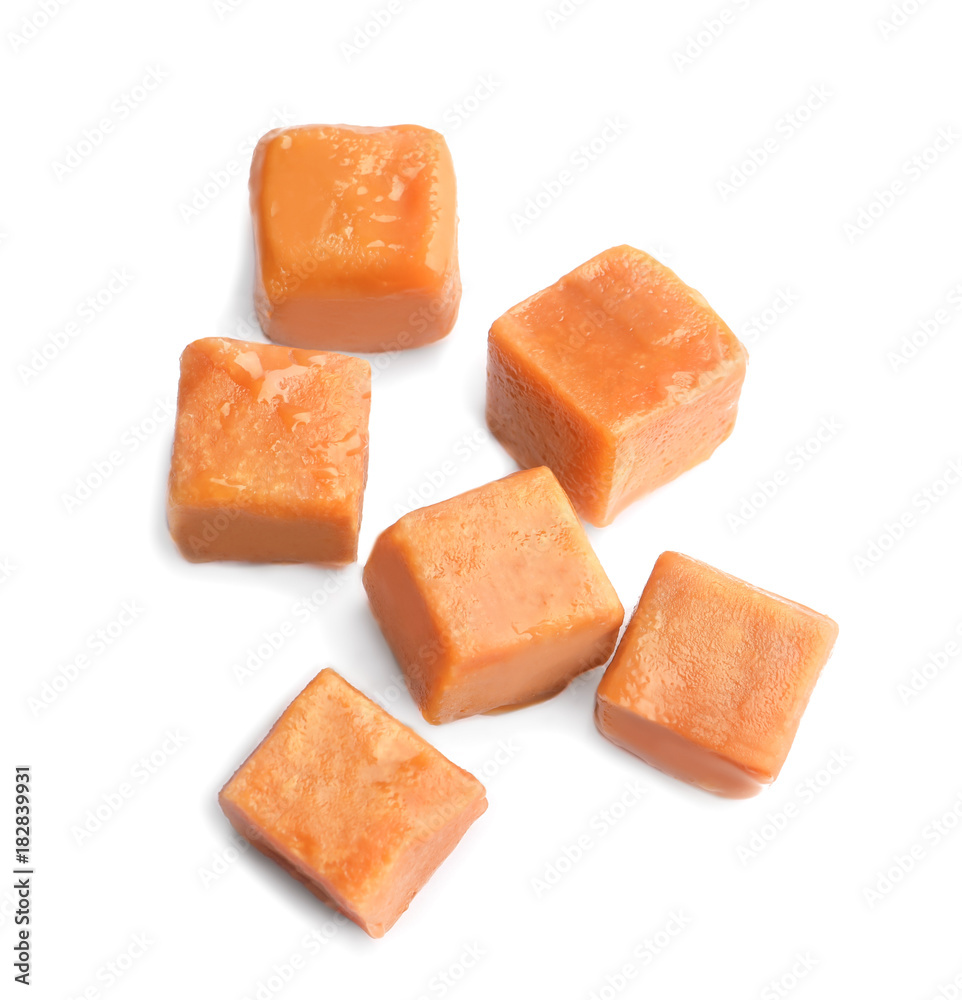 Delicious caramel candies on white background Delicious caramel candies on white background