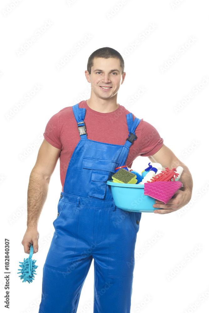 Young man with cleaning supplies on white background Young man with cleaning supplies on white background