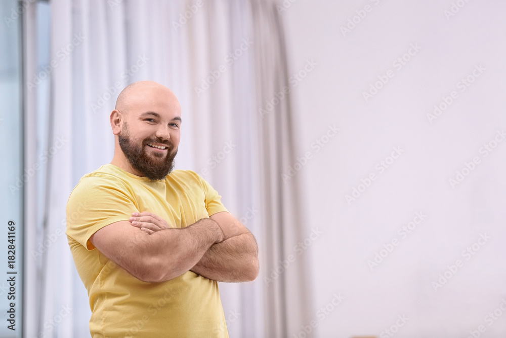 Overweight young man at home