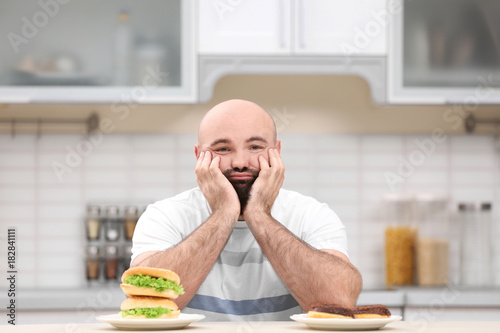 Overweight young man with u...