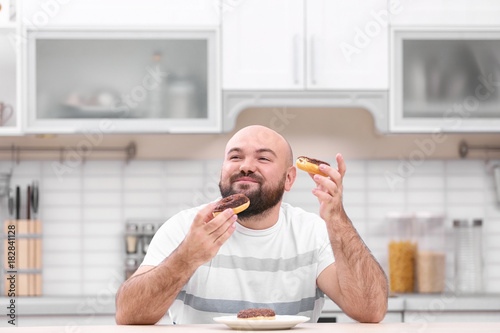 Overweight young man with u...