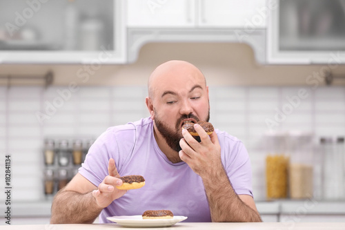 Overweight young man with u...