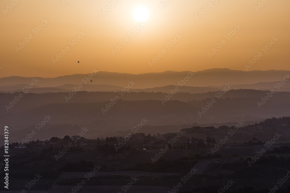 Sunset over the hills of Siena in Tuscany