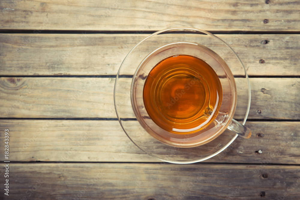 Cup with green tea on grey wooden background Cup with green tea on grey wooden background