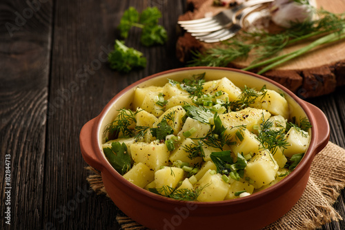Potato salad with leek, parsley, dill and olive oil.
