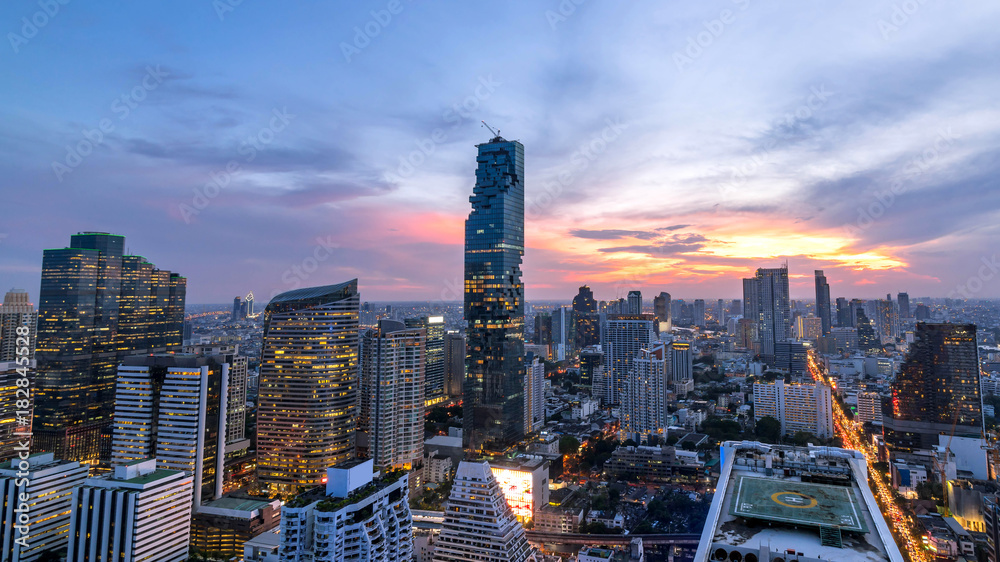 beautiful sunset cityscape of Bangkok city downtown at night  , landscape Thailand