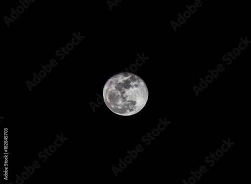 Close up full moon illuminated in dark night