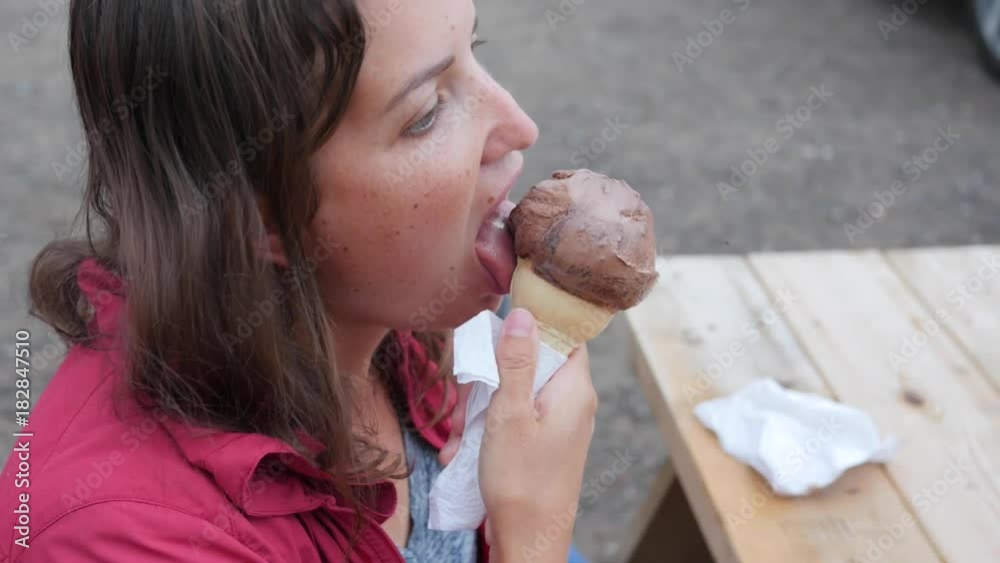 Woman eats ice cream in a cone