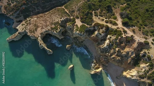 Aerial. Video from the sky of the rocks and the shores of the beaches of Portimao. Algarve