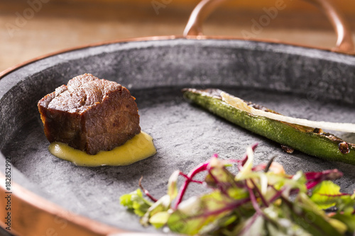 Dried Beef with coriander bernaise, grilled okra and homemade chips photo