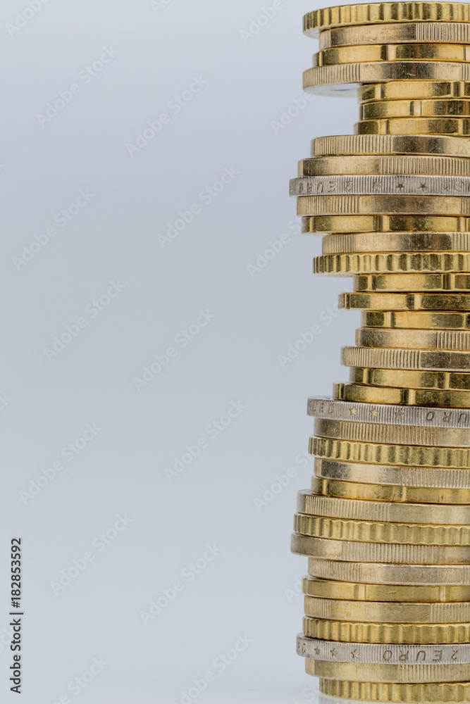 stack of money coins in front of white background