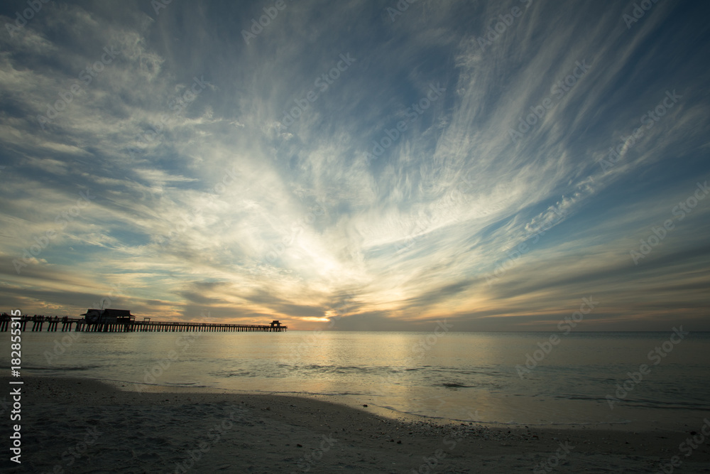 Fototapeta premium Wide Angle View of Naples Beach and Pier at Sunset