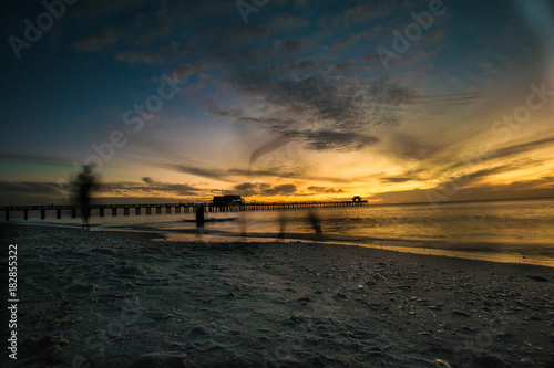 Moody Sunset at Naples Beach Pier © Eileen