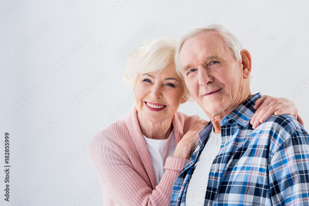 portrait of happy senior couple looking at camera portrait of happy senior couple looking at camera