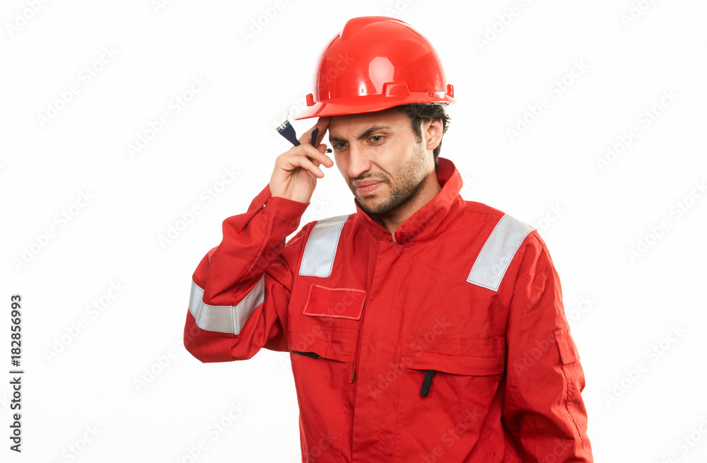 Young engineer worker in red helmet Young engineer worker in red helmet