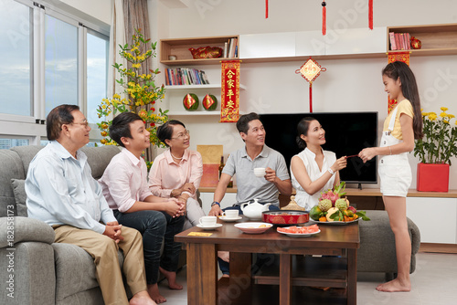 Asian family celebrating Tet