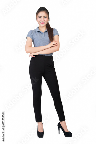 Smiling young woman in gray polo shirt with arms crossed on a white background