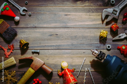 Merry christmas and Happy New year with handy tools background concept, Used old rusty constructor tools with Christmas decoration on wood