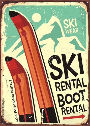 Ski rental retro sign design with pair of skis and winter mountain shape