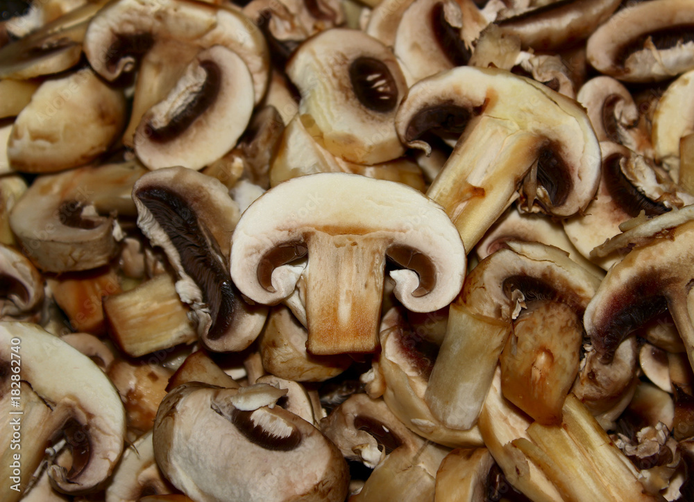 Healthy Food Background. Mushrooms Champignons. Fried mushrooms close up.Background Of Sliced Mushrooms. Healthy Food Background. Mushrooms Champignons. Fried mushrooms close up.Background Of Sliced Mushrooms.