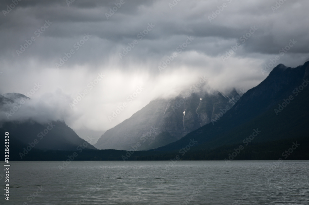 Heavy clouds over a mountain lake