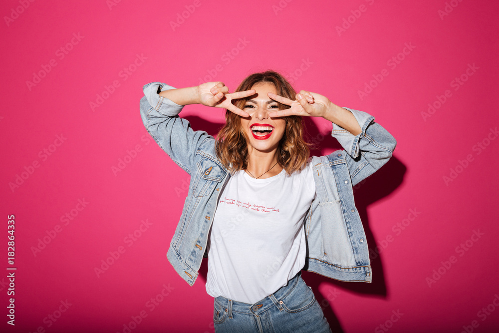 Smiling young woman isolated over pink Smiling young woman isolated over pink