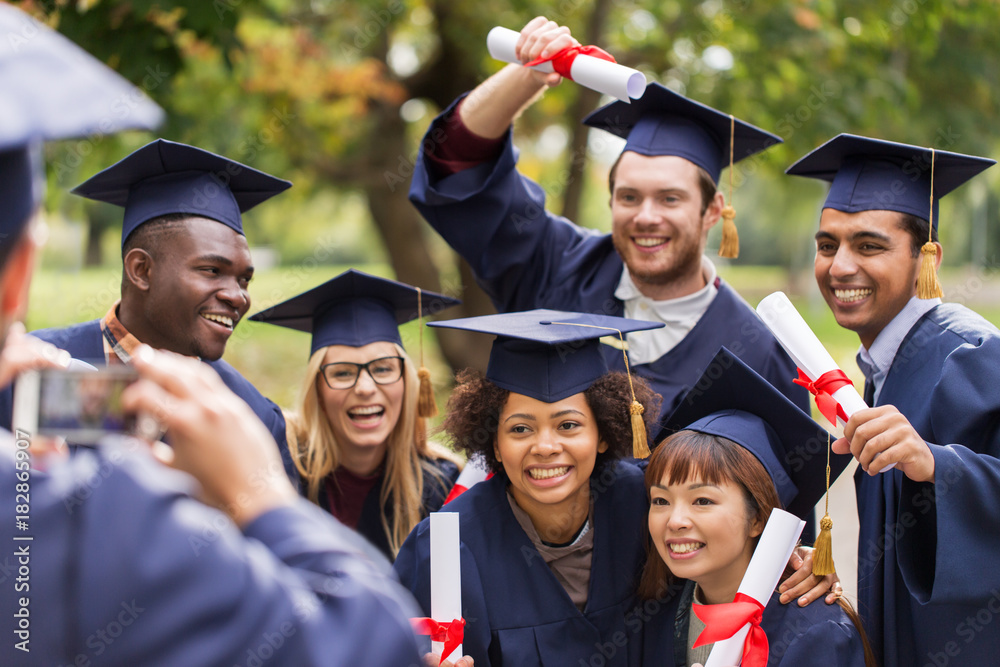 students or graduates with diplomas taking picture Stock Photo | Adobe ...