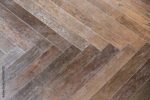 zigzag wood floor pattern background with light from window close up detail