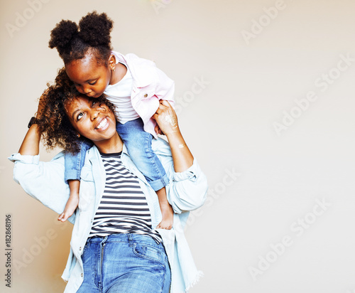 adorable sweet young afro-american mother with cute little daugh