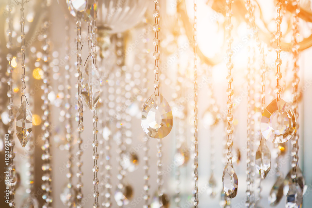 Luxury crystal chandelier close-up. Glamour background with copy space