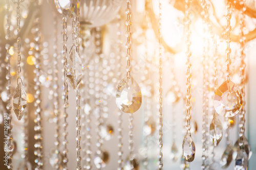 Luxury crystal chandelier close-up. Glamour background with copy space © whyframeshot