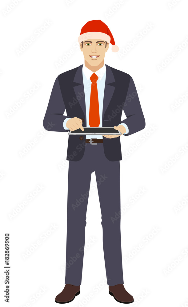 Businessman in Santa hat using digital tablet PC Businessman in Santa hat using digital tablet PC