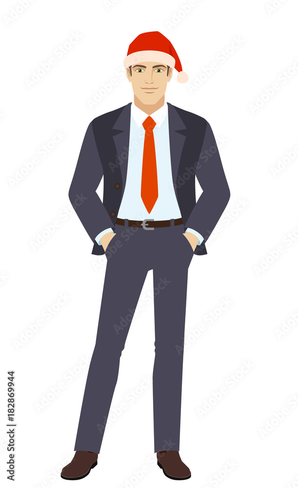 Businessman in Santa hat standing with hands in pockets Businessman in Santa hat standing with hands in pockets