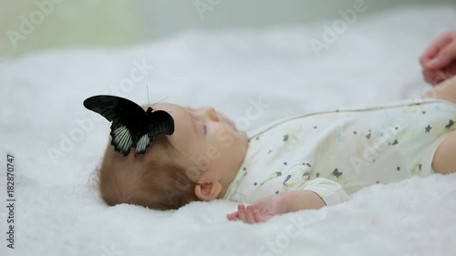 little baby and butterfly, mother tickled the child
