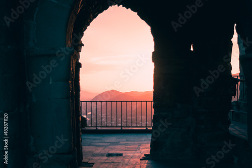 The scene of sunset through the arch in Jvari Church near Mtskheta, Georgia photo