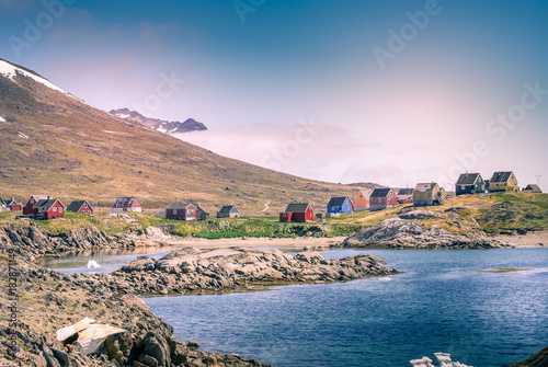 Greenland : bay with an inuit village, colored houses bay with an inuit village