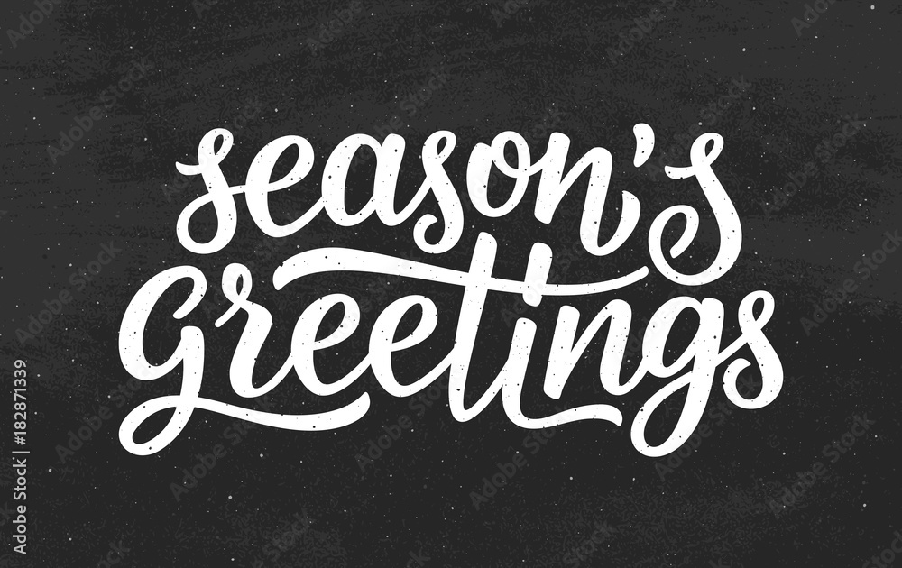 Seasons greetings calligraphy lettering text on black chalkboard ...