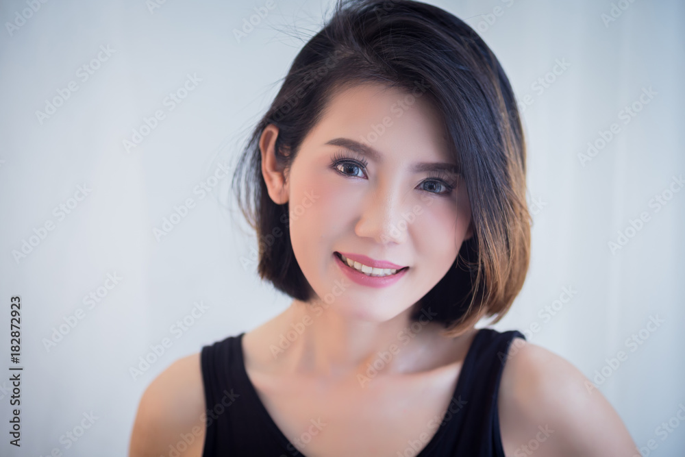 beautiful asian girl casual costume ralax on white bed next to window curtian with sunlight beauty skin concept beautiful asian girl casual costume ralax on white bed next to window curtian with sunlight beauty skin concept