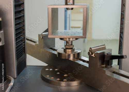 Machine for testing samples for tensile strength